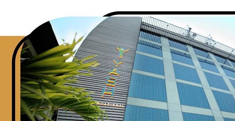 Yash International exterior — glass façade on Mavoor Road, Calicut