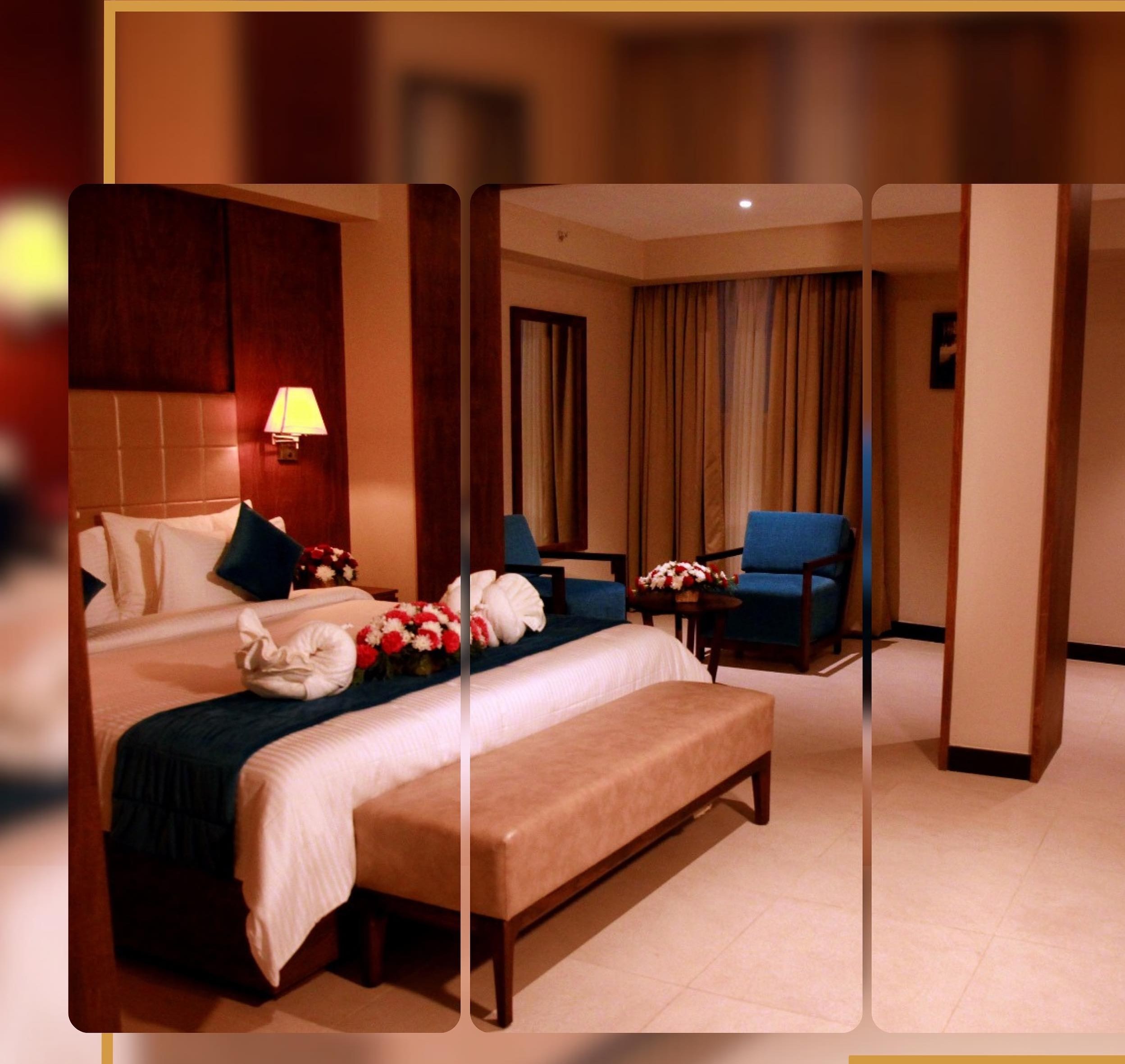 Yash International suite with king bed and teal accents
