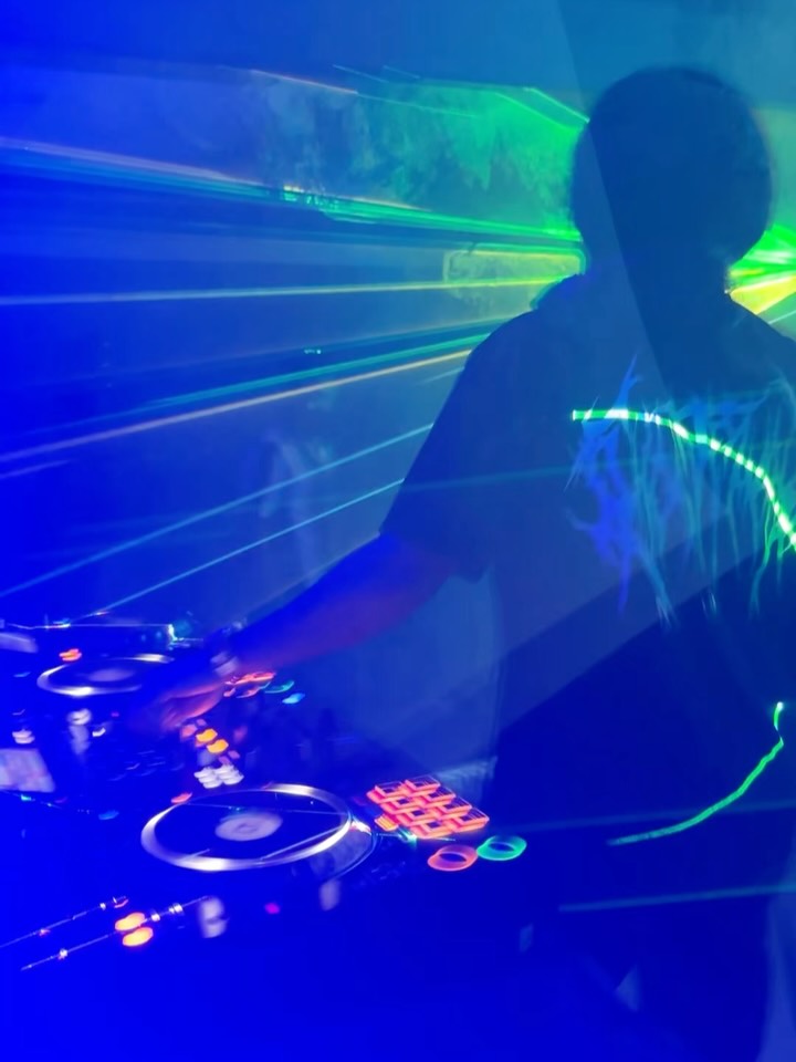 DJ booth in blue laser light